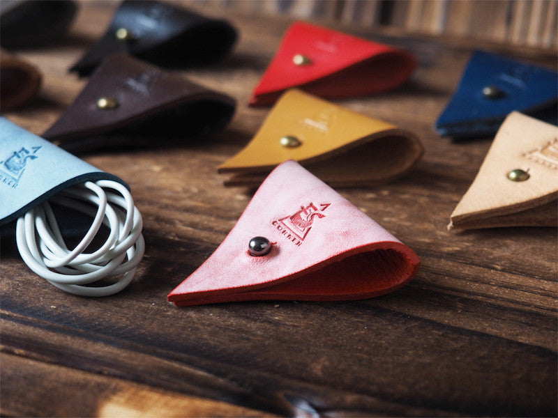 ES Corner Leather Cord Holder cable organizer Close up Red coated with wax